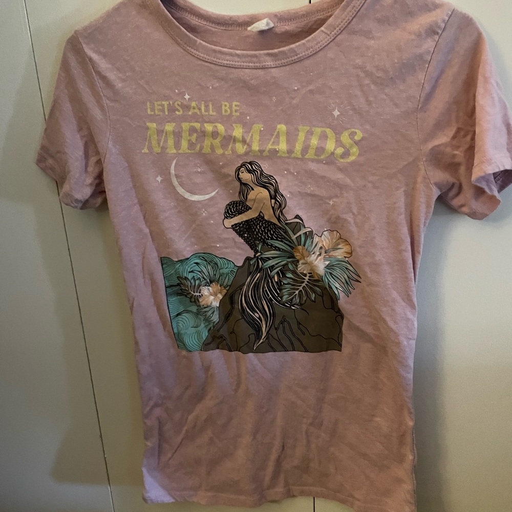 Appears to be a small pink charolette russe shirt